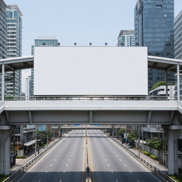 Wide horizontal blank white billboard attached to the outer parapet of a pedestrian overpass in Bangkok, empty multilane roadway and urban buildings below.