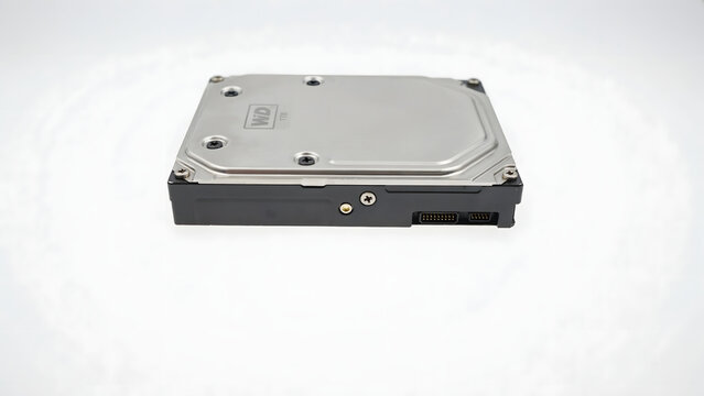 A western digital internal hard disk drive with a silver metal and black base, isolated on a white background, showing the label and ports