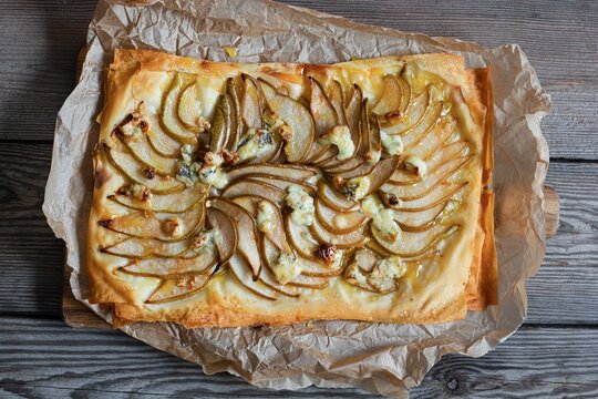  Phyllo dough tart, fruits (grapes, pears), cheese and nuts with honey. Cooking mediterranean cuisine.