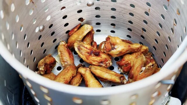 Close Up Of Fried Chicken Wings In Basket