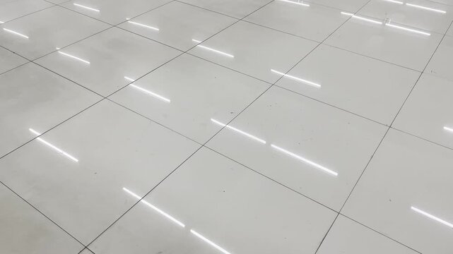 Glossy white ceramic floor tiles texture with neon light reflection