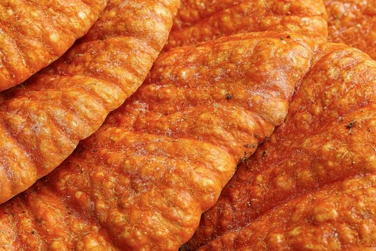 Pork rinds crispy salty snack close up macro appetizing background