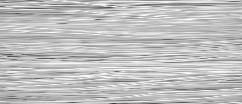 Monochromatic horizontal lines create textured surface. Gray shades vary subtly across the image. pattern adds visual interest. Ideal for design backgrounds