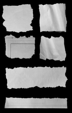 Torn papers on black