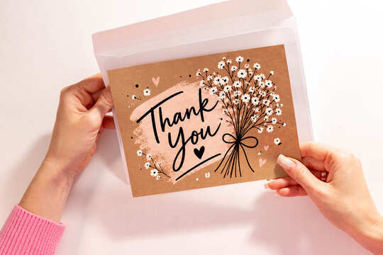Thank You Card with Baby Breath Flowers and Handwritten Gratitude Message.
