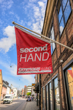 Lund, Sweden - August 06 2026: Red Emmaus Lund second hand shop sign outdoors.