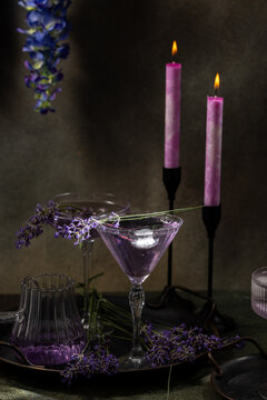 Lavender cocktail drinks with candles creating a relaxing mood