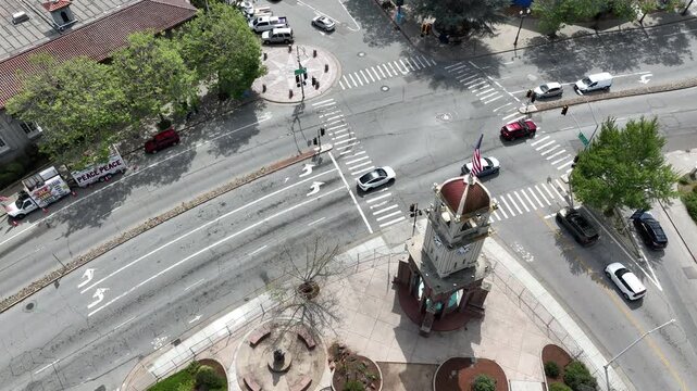 Aerial view of afternoon traffic passing the historic clock tower of downtown Santa Cruz, California, USA.