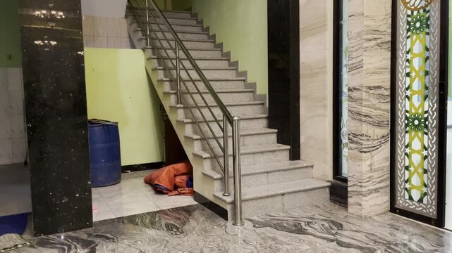 Modern interior staircase with stainless steel handrails in commercial building