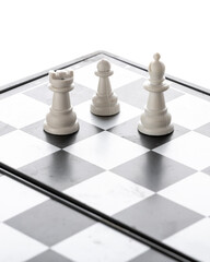 white chess pieces standing on checkerboard against bright white background representing tactical strategy intelligence competition and minimalist leisure gaming © PhotoFed