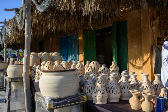 Doha, Qatar &ndash; November 29, 2023: A daytime shot from the Katara Traditional Dhow Festival showing a popular market displaying a variety of traditional pottery, decorative geometrically perforated clay