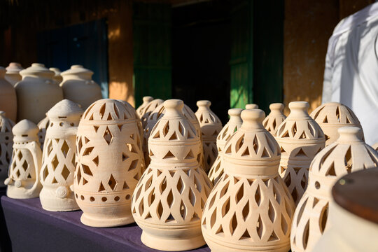Doha, Qatar &ndash; November 29, 2023: A daytime shot from the Katara Traditional Dhow Festival showing a popular market displaying a variety of traditional pottery, decorative geometrically perforated clay