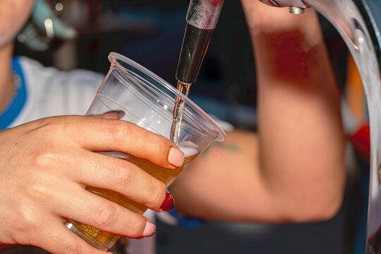 A professional beer draft machine pouring fresh lager into glass steins. Perfect for Oktoberfest festival concepts, pub bar equipment, and traditional German beer celebrations.

