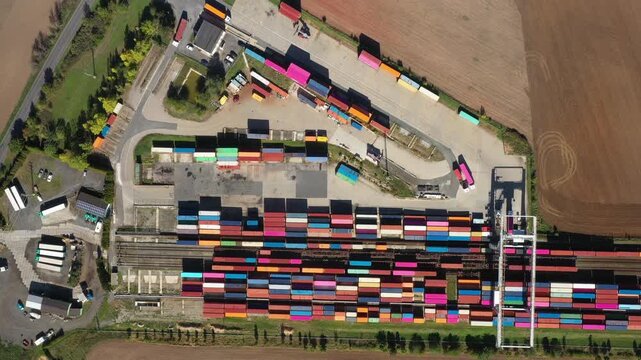 Aerial view of containers at railway. Big container terminal on a railroad with open storage area.