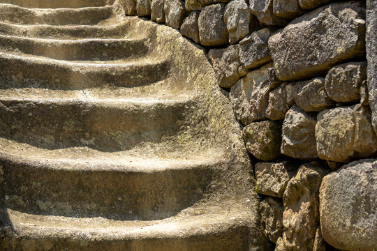 Close up of ancient Inca stone staircase and finely fitted masonry at Machu Picchu, Peru, revealing remarkable pre-Columbian engineering