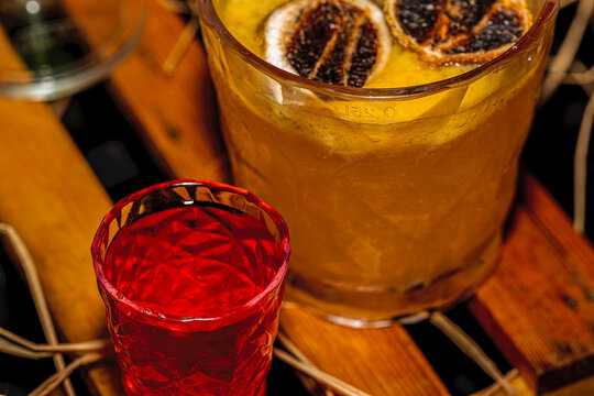 Close up of colorful tropical cocktails served at a luxury 5-star hotel buffet entrance for an upscale Oktoberfest celebration.
