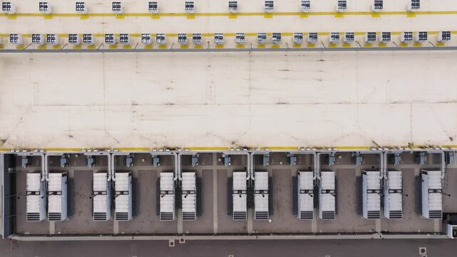 Aerial view of rows of white industrial power units arranged in a grid pattern at a facility in the United States.