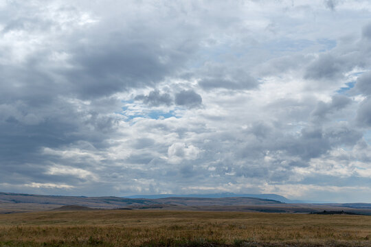 Gathering stormclouds over open prairie