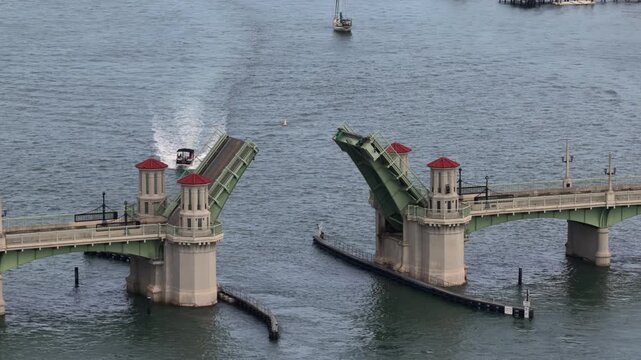 Aerial view of the Bridge of Lions bascule bridge opening to allow a boat to pass through the Matanzas River in St. Augustine, Florida, United States.