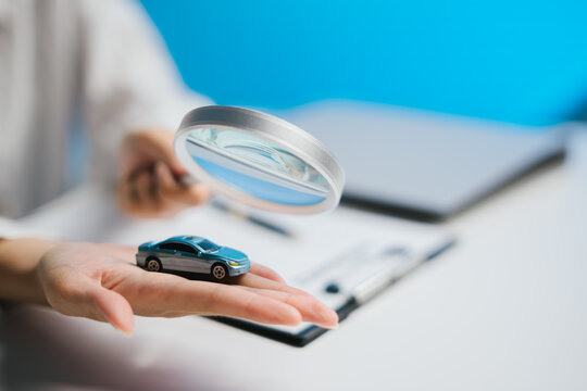 Miniature car magnifier hand inspection focus detail automobile inspection curious attention