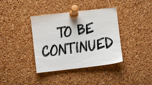 A note pinned to a cork board reads To Be Continued in black ink. This captures a sense of anticipation and future narrative development.