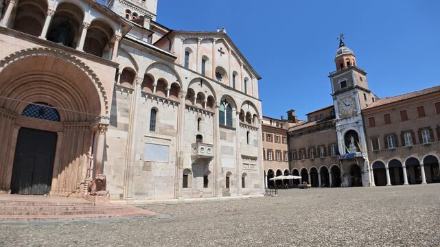 Scenic view of the historic Modena cathedral and its bustling Grand square under a clear blue sky in Modena city, Italy of Modena city in Italy