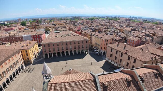 Expansive aerial shot capturing the vibrant Piazza Grande, heart of Modena city, as seen from Ghirlandina bell tower of Modena city in Italy