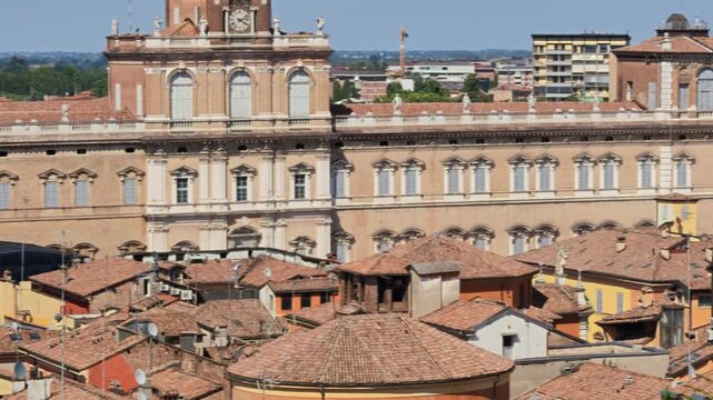 Panoramic view of Modena's vibrant downtown, captured from the iconic Ghirlandina bell tower, showcasing the Ducal Palace of Military Academy and historic architectures of Modena city in Italy
