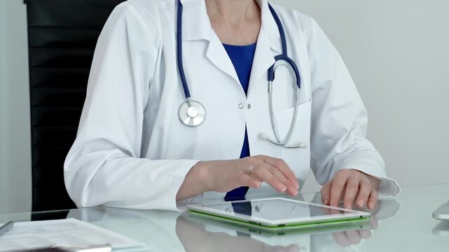Medical professional using digital tablet, leveraging modern technology for patient care and health consultation, researching crucial information, and managing medical records