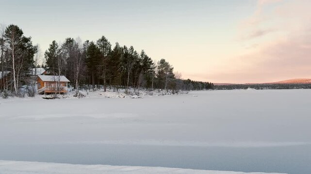 Remote Winter House by Frozen Lake Inari Lapland Finland