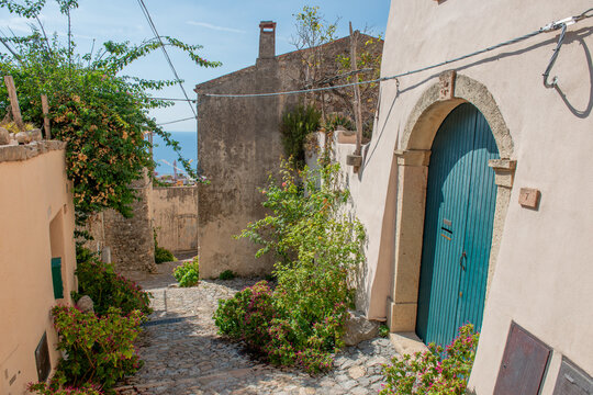 Stone path and dry-stone walls in Borgio Verezzi, a historic Ligurian village.