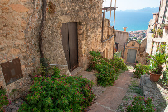 Stone path and dry-stone walls in Borgio Verezzi, a historic Ligurian village.