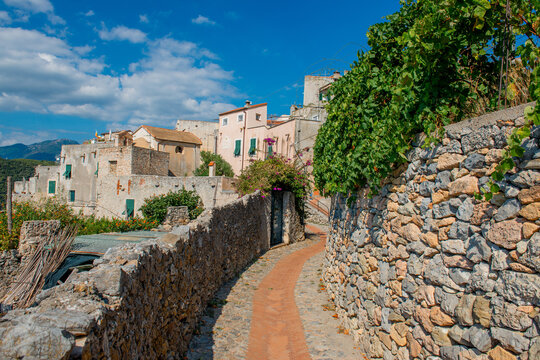 Stone path and dry-stone walls in Borgio Verezzi, a historic Ligurian village.