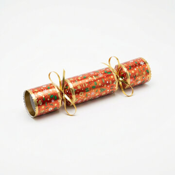 Christmas cracker with festive pattern on white background