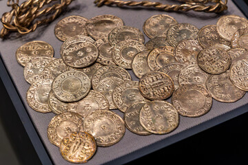 Collection of 10th-century Viking silver coins and twisted arm ring hoard © whitcomberd