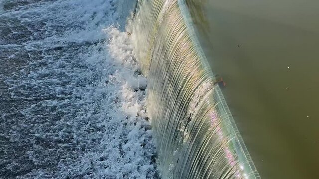 Powerful River Water Flowing Over Rubber Dam Structure