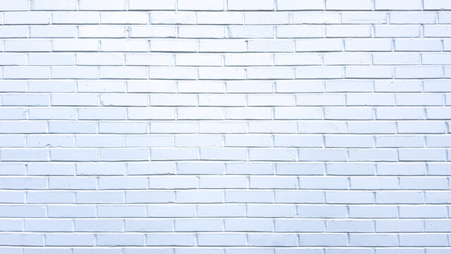 horizontal rows of white painted bricks with neat mortar joints form a clean masonry wall texture