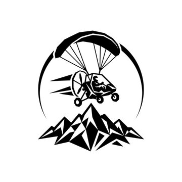 Paramotor Flight Over Jagged Mountains