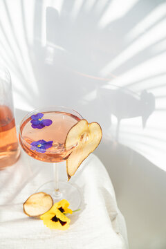 Wine summer cocktails and dried fruit appetizers. Tropical light background