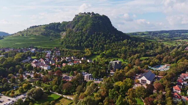 Aerial view of the town of Singen am Hohentwiel with the newly built Scheffelhalle, reopened in 2025, behind it the Aachbad, outdoor pool, on the left the Mac Art Cars Museum, above it the Hegau volc
