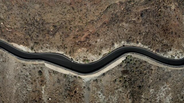 Drone shot, cyclist on the mountain road at the Degollade de las Yeguas viewpoint, Gran Canaria, Canary Islands, Spain