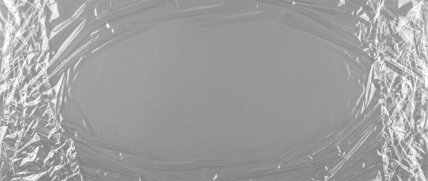 Crumpled Transparent Plastic Film Wrap Texture on Grey with Clear Centre for Photo Overlay and Packaging Design