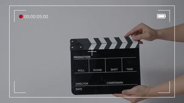 Super Clapperboard Hitting Infront Of Camera In Studio Close Up