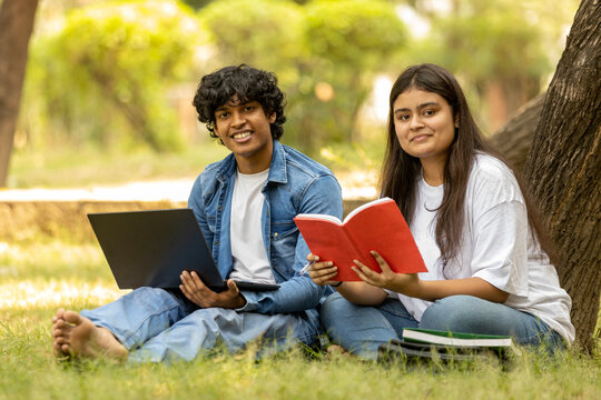 Indian college Student  studying at park