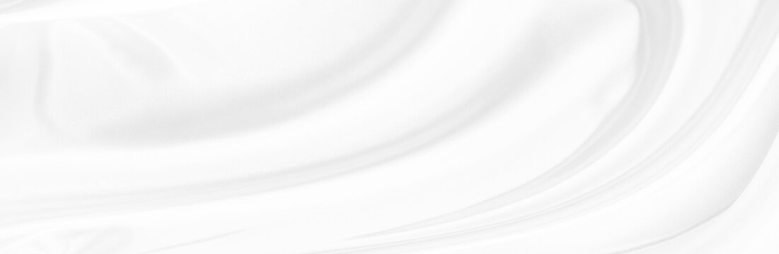 White gray satin texture that is white silver fabric silk background with beautiful soft blur pattern natural.