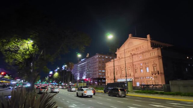 Illuminated Teatro Colon Facade and Traffic on 9 de Julio Avenue at Night