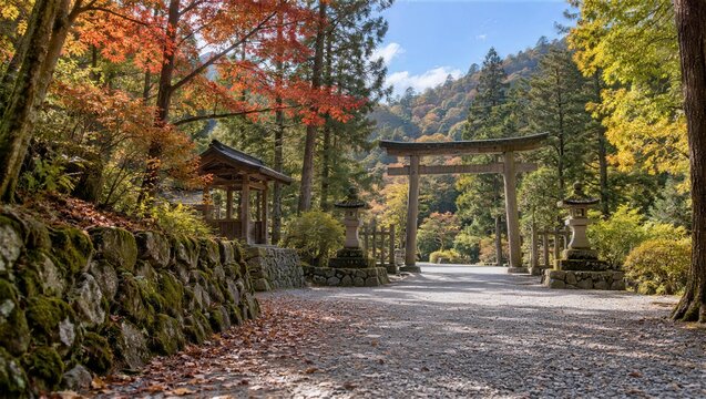 苔むした石垣と紅葉に囲まれた鳥居への参道