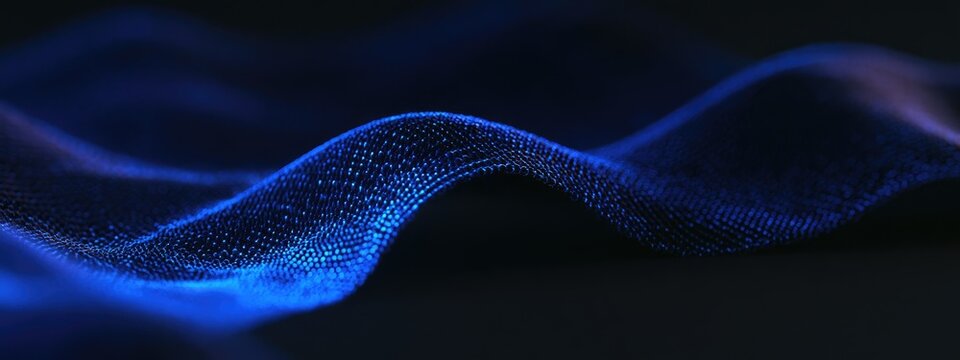 Abstract flowing blue wave background with glowing particles.