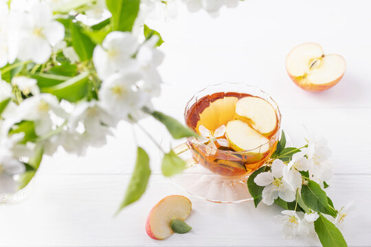 Cup of tea with apple blossoms. Spring ceremony