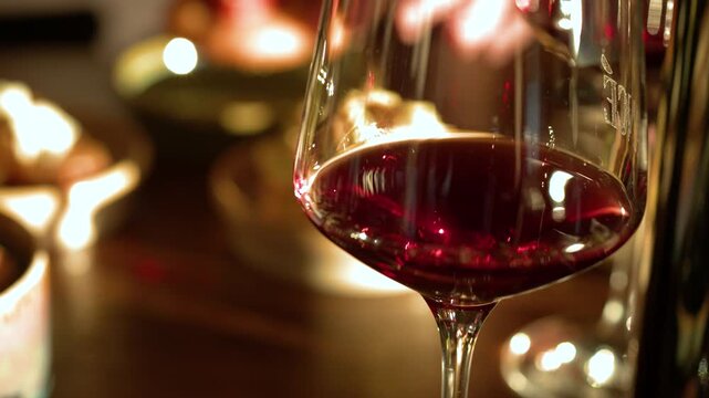 Close Up of Red Wine Glass in Dimly Lit Restaurant